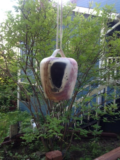 decorative bell hanging in garden - Whitehorse B&B